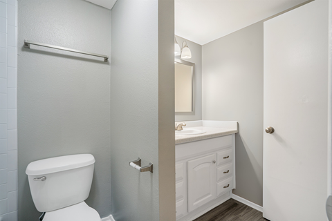 an empty bathroom with a toilet and a sink